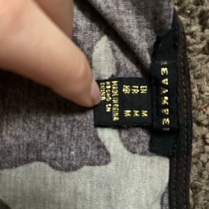 Size medium, barley worn, has adjustable strings on front of shirt